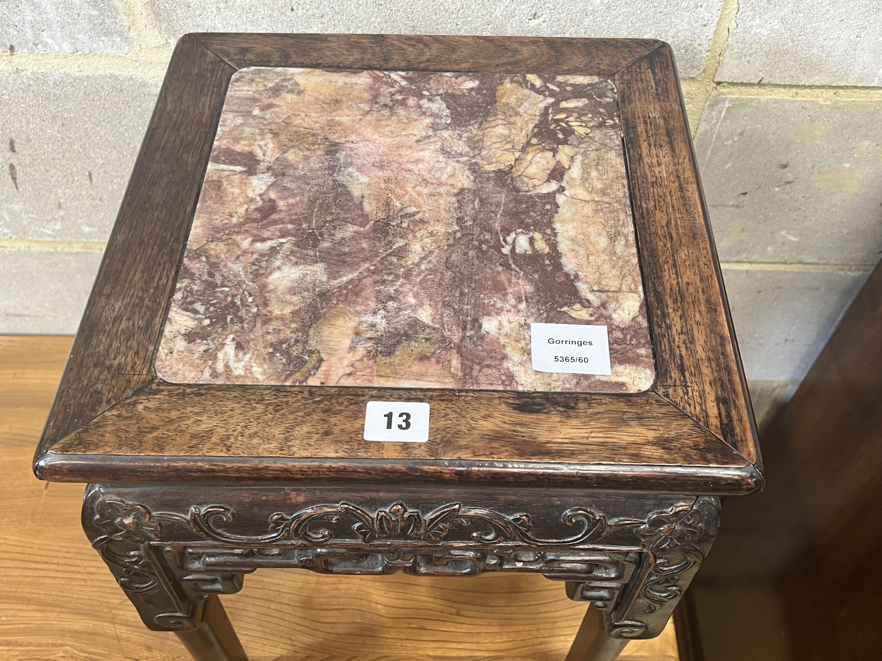 A Chinese marble topped carved hardwood jardiniere stand, width 35cm depth 35cm height 47cm